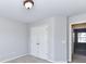 Bedroom with carpet, light walls, and a double door closet with brass hardware at 12907 Mccahan Ln, Huntersville, NC 28078