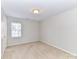 Bedroom with light walls, carpeted floor, and a window providing natural light at 12907 Mccahan Ln, Huntersville, NC 28078