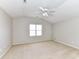 Neutral bedroom features a carpeted floor, light walls, and a ceiling fan at 12907 Mccahan Ln, Huntersville, NC 28078