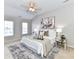 Tranquil bedroom features neutral tones, tray ceiling, and a large window offering natural light at 12907 Mccahan Ln, Huntersville, NC 28078