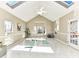 Bright bonus room featuring skylights, ceiling fan and french doors at 12907 Mccahan Ln, Huntersville, NC 28078