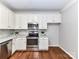 Kitchen featuring stainless steel oven, microwave, granite counters and tile backsplash at 12907 Mccahan Ln, Huntersville, NC 28078