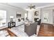 Cozy living room featuring a fireplace, hardwood floors, and neutral decor at 12907 Mccahan Ln, Huntersville, NC 28078