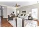 Comfortable living room featuring a fireplace, hardwood floors, and neutral decor at 12907 Mccahan Ln, Huntersville, NC 28078