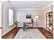 Bright and airy office space with hardwood floors, neutral walls, and natural light from the window at 12907 Mccahan Ln, Huntersville, NC 28078