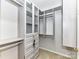 Spacious walk-in closet with custom shelving and drawers for optimal organization at 12907 Mccahan Ln, Huntersville, NC 28078