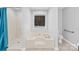 Bathroom featuring a soaking tub, shower, and white tiled walls at 13501 Misty Dew Ct # 19, Charlotte, NC 28273