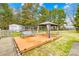 Wooden deck with a swing and gazebo providing a relaxing outdoor space at 13501 Misty Dew Ct # 19, Charlotte, NC 28273