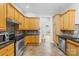 Well-equipped kitchen featuring stainless steel appliances, tile backsplash, and granite countertops at 13501 Misty Dew Ct # 19, Charlotte, NC 28273