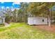 Backyard shed with a door and window, perfect for storage or workshop at 13501 Misty Dew Ct # 19, Charlotte, NC 28273