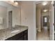 Bathroom featuring a granite countertop vanity with a large mirror at 1412 Great Rd, Waxhaw, NC 28174