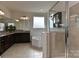 Elegant bathroom featuring a soaking tub, glass shower, and granite countertop vanity at 1412 Great Rd, Waxhaw, NC 28174