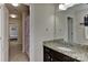 Bathroom featuring a granite countertop vanity with a large mirror at 1412 Great Rd, Waxhaw, NC 28174