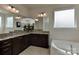 Elegant bathroom featuring double vanity with granite countertops and a soaking tub at 1412 Great Rd, Waxhaw, NC 28174