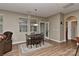 Cozy dining area features a wooden table and chairs, with natural light from a window at 1412 Great Rd, Waxhaw, NC 28174