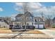 Charming two-story home with a welcoming front porch and a well-manicured lawn, perfect for suburban living at 1412 Great Rd, Waxhaw, NC 28174