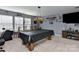 Spacious game room featuring a pool table with windows providing ample natural light at 1412 Great Rd, Waxhaw, NC 28174