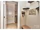 Well-organized hallway with shelving, coat hooks, and easy access to the laundry room at 1412 Great Rd, Waxhaw, NC 28174