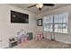 Bright playroom with a play kitchen, table, and large window for natural light at 1412 Great Rd, Waxhaw, NC 28174