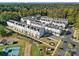 Wide aerial shot of a modern townhome community with tidy landscaping and a playground nearby at 14139 Loyola Ridge Dr, Charlotte, NC 28277