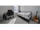 Bedroom with black metal bed frame, a guitar, an office chair and desk setup, and carpet at 14139 Loyola Ridge Dr, Charlotte, NC 28277