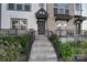 Inviting front entrance featuring a covered porch with steps and wrought iron railings and detailed front door at 14139 Loyola Ridge Dr, Charlotte, NC 28277