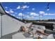 A rooftop patio with a seating arrangement, string lights, and views of the surrounding neighborhood at 14139 Loyola Ridge Dr, Charlotte, NC 28277