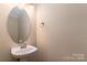 Stylish half bathroom with modern sink and lighting at 14955 Alexander Place Dr, Huntersville, NC 28078