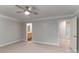 Neutral primary bedroom featuring a ceiling fan and adjoining bathroom at 14955 Alexander Place Dr, Huntersville, NC 28078