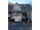 Townhouse exterior with a garage and neutral-colored siding at 14955 Alexander Place Dr, Huntersville, NC 28078