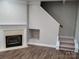 Gas fireplace with a white mantel in the living room at 14955 Alexander Place Dr, Huntersville, NC 28078