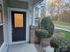 Dark blue front door with a glass insert adds curb appeal at 14955 Alexander Place Dr, Huntersville, NC 28078