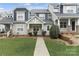 Charming townhome with a well-manicured lawn and inviting walkway at 14955 Alexander Place Dr, Huntersville, NC 28078