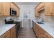 Modern kitchen with stainless steel appliances and granite countertops at 14955 Alexander Place Dr, Huntersville, NC 28078