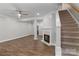 Spacious living room featuring a fireplace and stairs at 14955 Alexander Place Dr, Huntersville, NC 28078