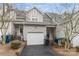 Rear exterior view of townhome showing garage and entryway at 14955 Alexander Place Dr, Huntersville, NC 28078