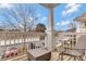 Private balcony with seating area, offering a tranquil outdoor space and a view of the surrounding parking lot at 16436 Redstone Mountain Ln, Charlotte, NC 28277