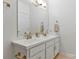 Bathroom featuring a dual sink vanity with granite countertops and bronze hardware at 16436 Redstone Mountain Ln, Charlotte, NC 28277