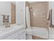 Modern bathroom featuring a vanity, toilet, and shower-tub combination with stylish tile accents for a fresh ambiance at 16436 Redstone Mountain Ln, Charlotte, NC 28277