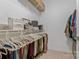 Organized walk-in closet featuring shelving, hanging racks, and ample storage space at 16436 Redstone Mountain Ln, Charlotte, NC 28277