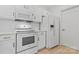 White kitchen includes a refrigerator and a microwave above the stove at 16436 Redstone Mountain Ln, Charlotte, NC 28277