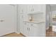 Elegant white kitchen cabinets featuring a spacious countertop at 16436 Redstone Mountain Ln, Charlotte, NC 28277