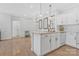 Open kitchen with a sink and modern appliances, open to the dining area at 16436 Redstone Mountain Ln, Charlotte, NC 28277