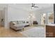 Inviting living room features neutral sofa, stylish floor lamp, and access to a sunny balcony through glass doors at 16436 Redstone Mountain Ln, Charlotte, NC 28277