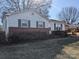 Ranch house with brick accents and landscaping at 1674 Fallston Rd, Shelby, NC 28150