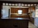 View of kitchen with wood cabinets and breakfast bar at 1674 Fallston Rd, Shelby, NC 28150