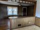 Living room with wood paneling and hardwood floors at 1674 Fallston Rd, Shelby, NC 28150