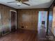 Hardwood floor living room, wood paneled walls at 1674 Fallston Rd, Shelby, NC 28150