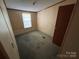 Small bedroom with window and closet at 169 Adams Cir, Candor, NC 27229