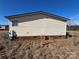 Side view of mobile home showing electrical box at 169 Adams Cir, Candor, NC 27229